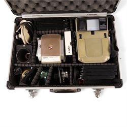Linhof Tecnika 70 medium format press camera serial no. 1711919, with a Xenotar 1:2.8/80 lens serial no. 9254350 and a Symmar 1:5.6/180 lens serial no. 8357904, both coupled to the camera, and additional accessories including Symmar-S 5.6/100 lens, and a Carl Zeiss Jena Apo-Lanthar 40mm1:4.5 macrolens, numbered set of seven Linhof dark slides, super rollex roll film holder and anatomical grip, all contained within modern case