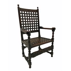 18th century joined oak carver armchair, the cresting rail carved with flower heads over lattice work back and seat, bobbin turned supports, scrolled acanthus leaf and flower head carved middle rail, pegged throughout 