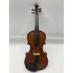 Four Chinese graduated violins - full size with 35.5cm two-piece back; three-quarter size with 33.5cm two-piece back; half size with 31cm two-piece back; and quarter size with 27.5cm two-piece back; all cased except full size; one with bow (4)