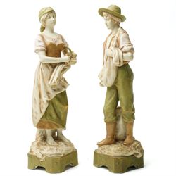 Pair of Royal Dux figures of agricultural workers modelled by Alois Hampel, one holding a scythe, the other sewing wheat model numbers 1457 and 1458 H32cm 