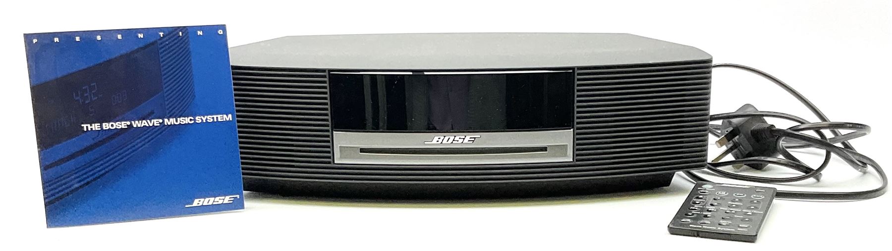 A Bose Wave music system, model AWRCC5, with remote control. 