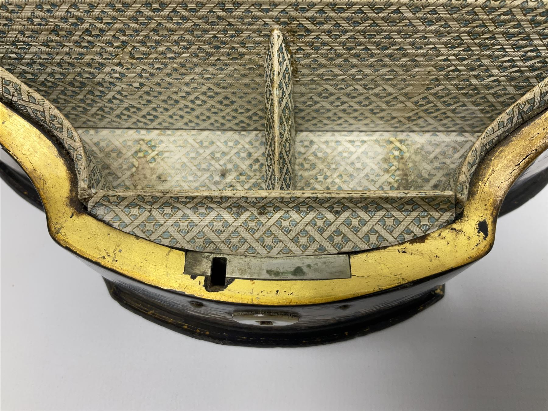 Victorian papier-mâché stationary box, of rounded wedge form with mother of pearl escutcheon, the hinged and curved cover and sides hand painted with floral sprays, opening to reveal a lined and fitted interior, H15cm L22cm D16cm