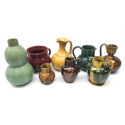  Collection of Dunmore pottery vases and jugs including a double gourd vase with textured glaze and other with various glazes, all stamped H20cm max and two matching pieces (10)  