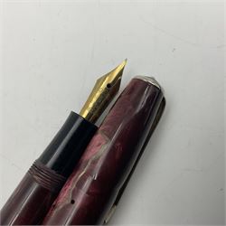 Six Burnham marbleised fountain pens, four with 14ct gold nibs