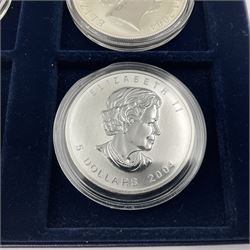 Four one ounce fine silver coins, forming 'The 2004 Famous World Silver Coin Collection', comprising United States eagle, Australian kangaroo, Chinese panda and Canadian maple leaf, cased with Westminster certificate 