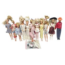 Eleven 1980s fashion dolls, predominantly Barbie/Ken, all dressed; together with some additional clothing.