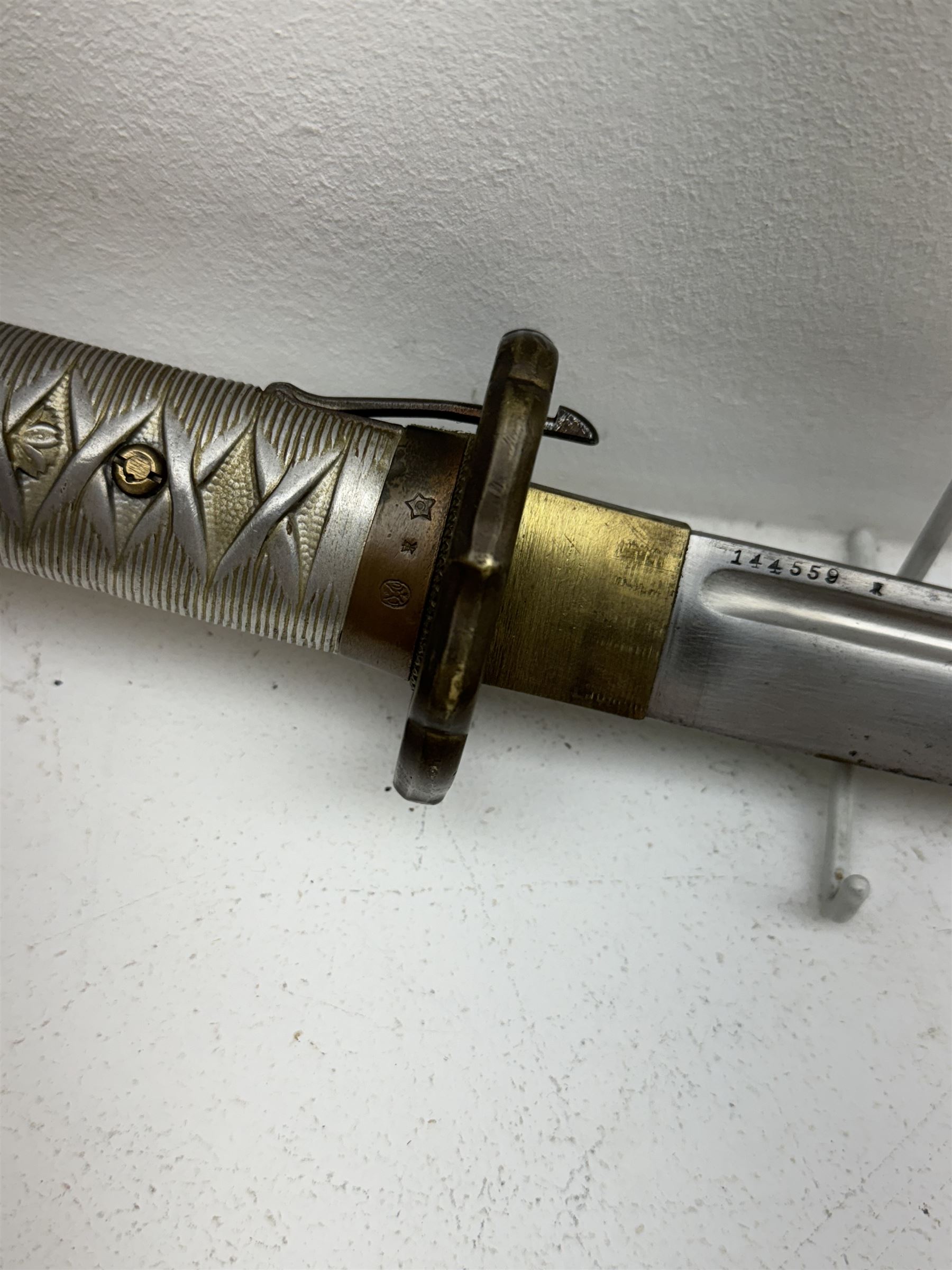 WWII Japanese katana with cast pierced tsuba, the L69cm arsenal steal blade marked 144559, with black lacquer Saya (scabbard), L97cm overall