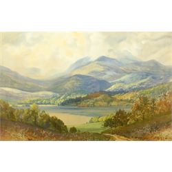 George Trevor (British fl.1920-1940): Loch with Mountains Beyond, watercolour signed 35cm x 53cm