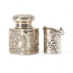 Late 19th century German Hanau silver miniature novelty scuttle, of cylindrical form with side handle and swing handle, the body impressed with figural genre scene, with Hanau marks for Karl Kurz, and hallmarked Samuel Boyce, Chester 1902, with 'F' foreign import mark, not including handle H3.5cm, together with a late 19th century German Hanau silver miniature novelty tea caddy, of rounded cube form, the body impressed with figures at work in a countryside setting, with Hanau marks for Neresheimer & Sohne, and hallmarked B Muller & Son, Chester import 1907, and marked 925, H5cm