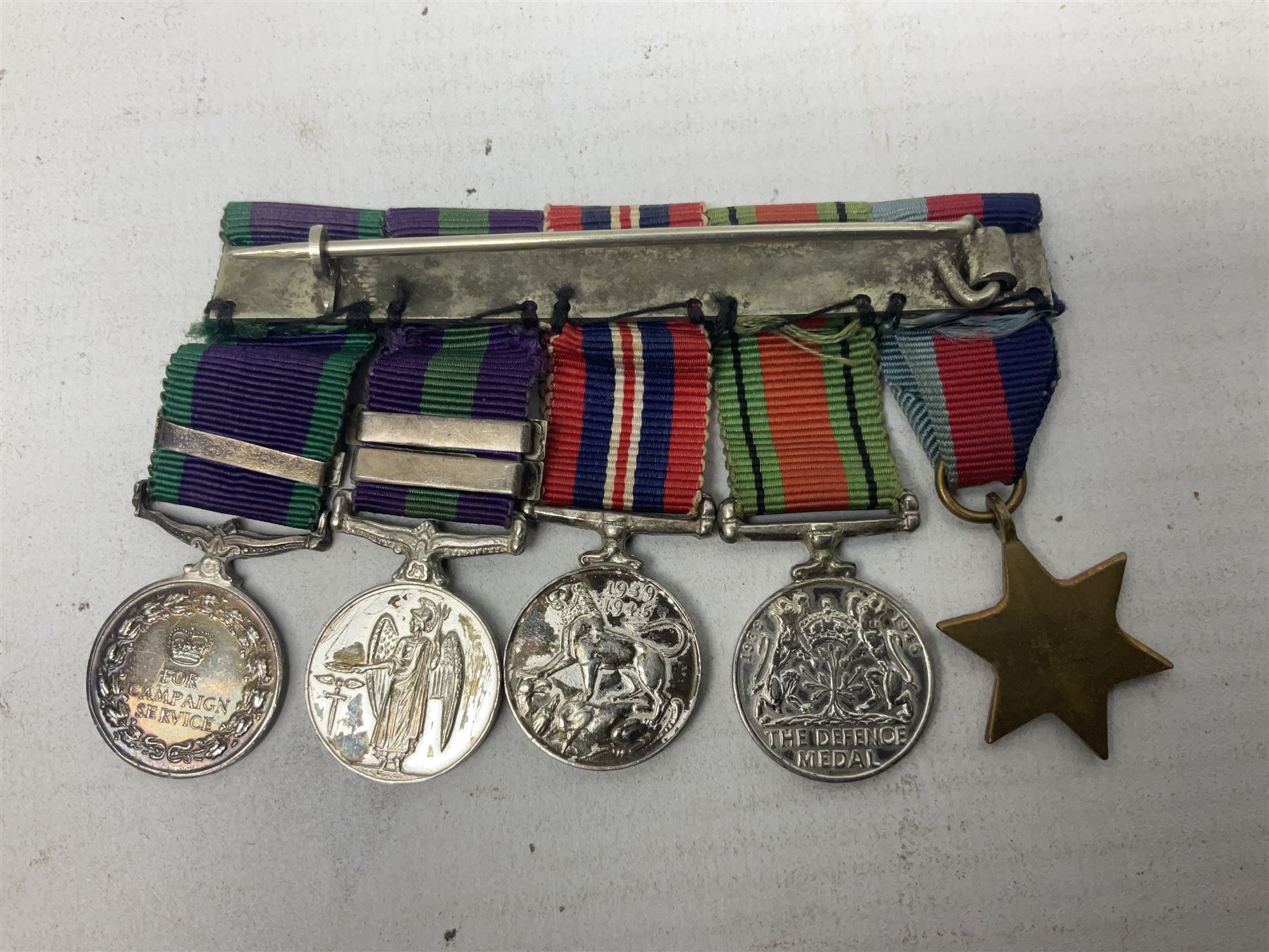 Three miniature groups of five medals - OBE Military group with WW1 trio and Italy Order of Saints Maurice & Lazarus Knights Cross; MBE Military group with WW2 trio and Territorial Efficiency Decoration; and WW2 trio, General Service Medal 1918-62 with Brunei and Arabian Peninsula clasps and GSM 1962 with Borneo clasp; all with ribbons on pinned wearing bars (3)