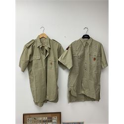Mid 20th century Boy Scouts uniform, comprising corduroy shorts, further pair of shorts, two shirts, socks, and felt hat, together a framed collection of Ogden's 'Boy Scots' cigarette cards, and an unframed print of Lord Baden Powell. 