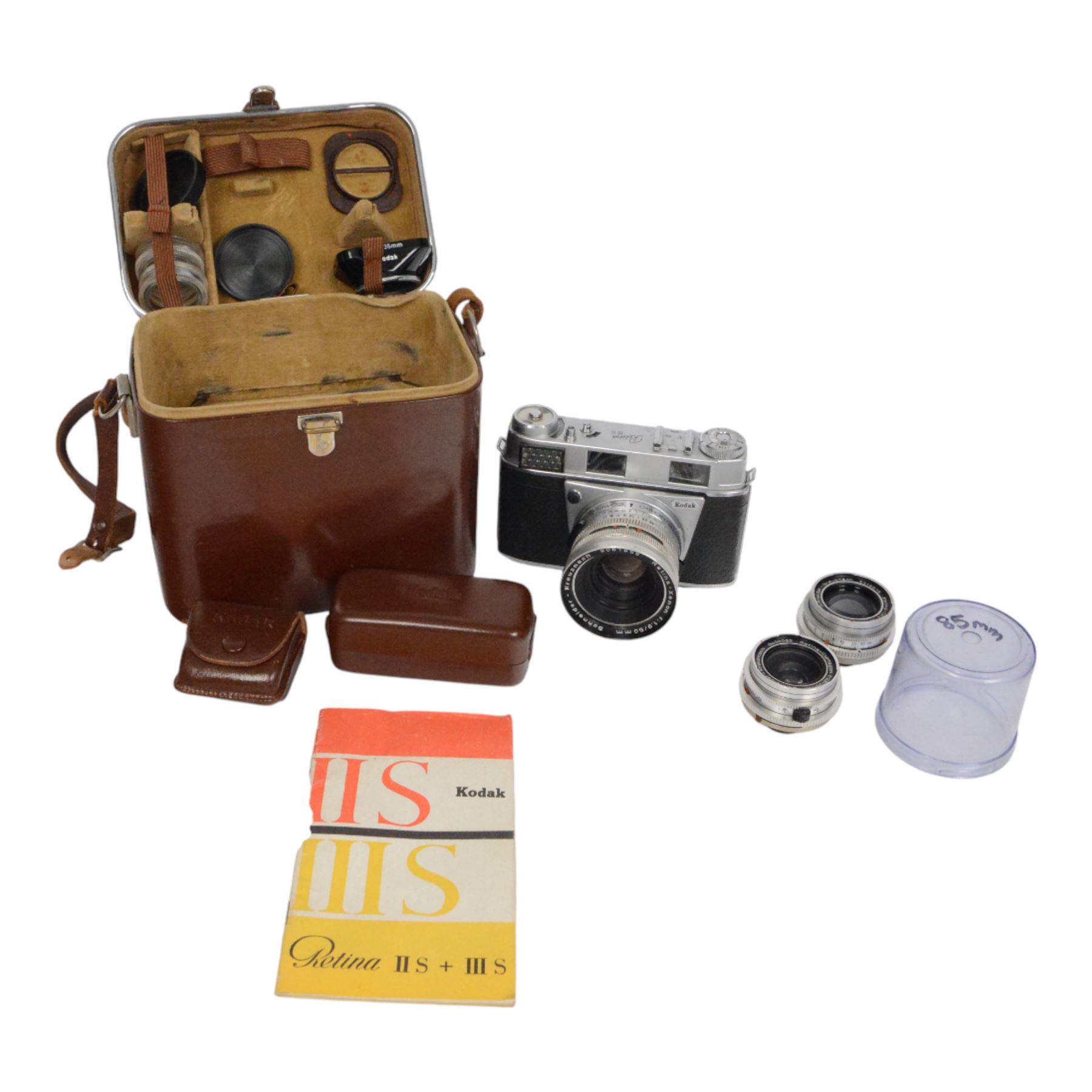 Kodak Retina III S camera outfit, comprising camera body serial no. 51394, three Schneider-Kreuznach lenses including Retina-Xenon f:1.9/50mm, Retina-Curtagon f:2.8/35mm and Retina-Tele-Arton f:4/85mm, viewfinder, close up rangefinder, filters and hood, contained within a brown Kodak carry case