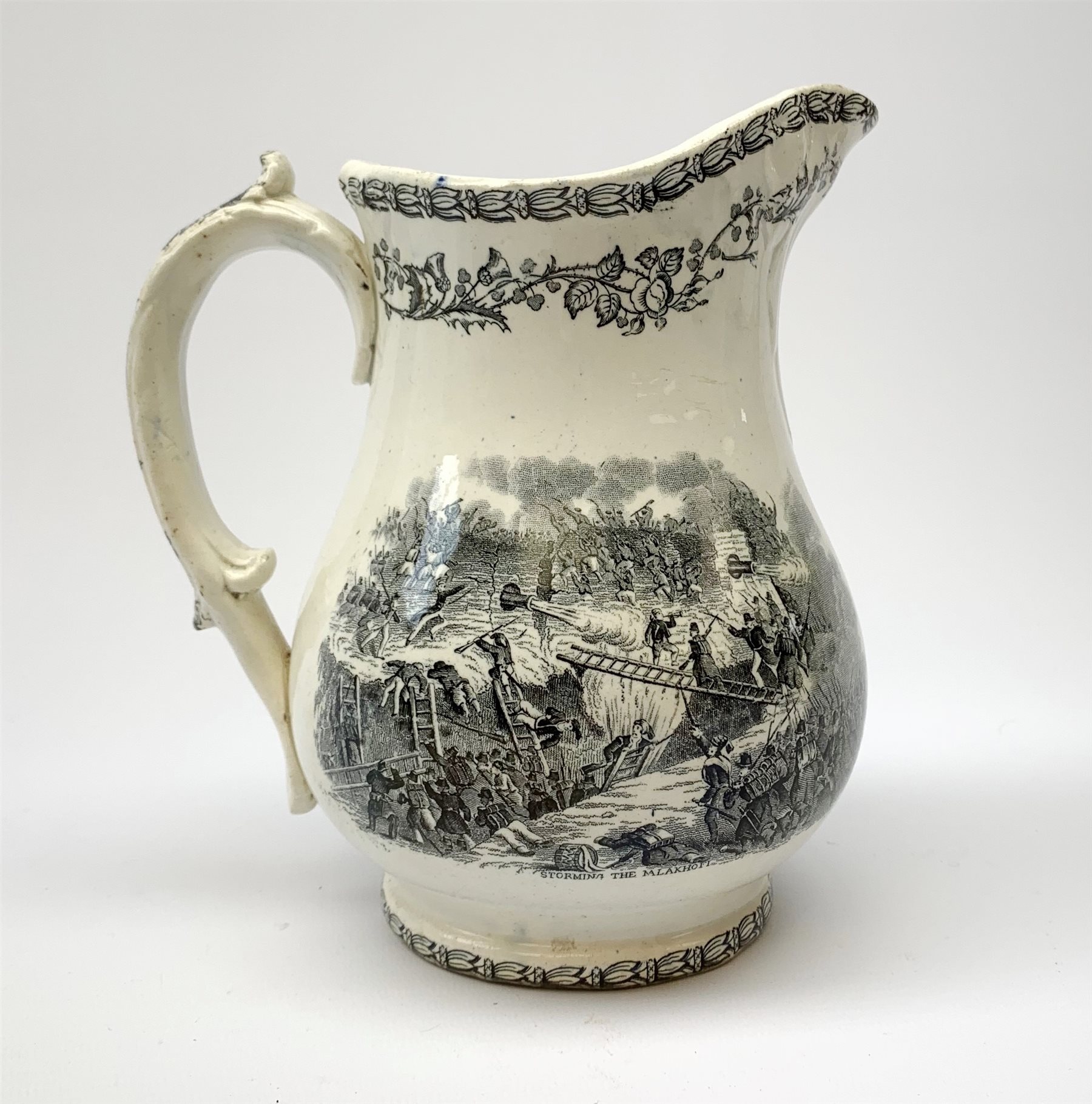 A 19th century Staffordshire pottery pearlware Crimea commemorative jug, black transfer printed with battle scenes, entitled Battle of Alma, Charge of the Highlanders, and Storming the Malakhofi, H18cm. 