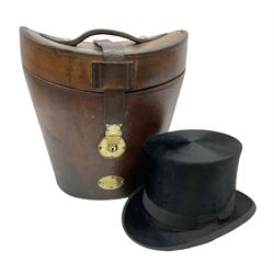 Early 20th century black silk top hat by Woodrow of Manchester and London, with manufacturer's stamp to the silk lined interior, housed in fitted tan leather hat box with removable internal compartments with straps, brass escutcheon and engraved plaque, hat internal measurements approx 20cm x 15cm