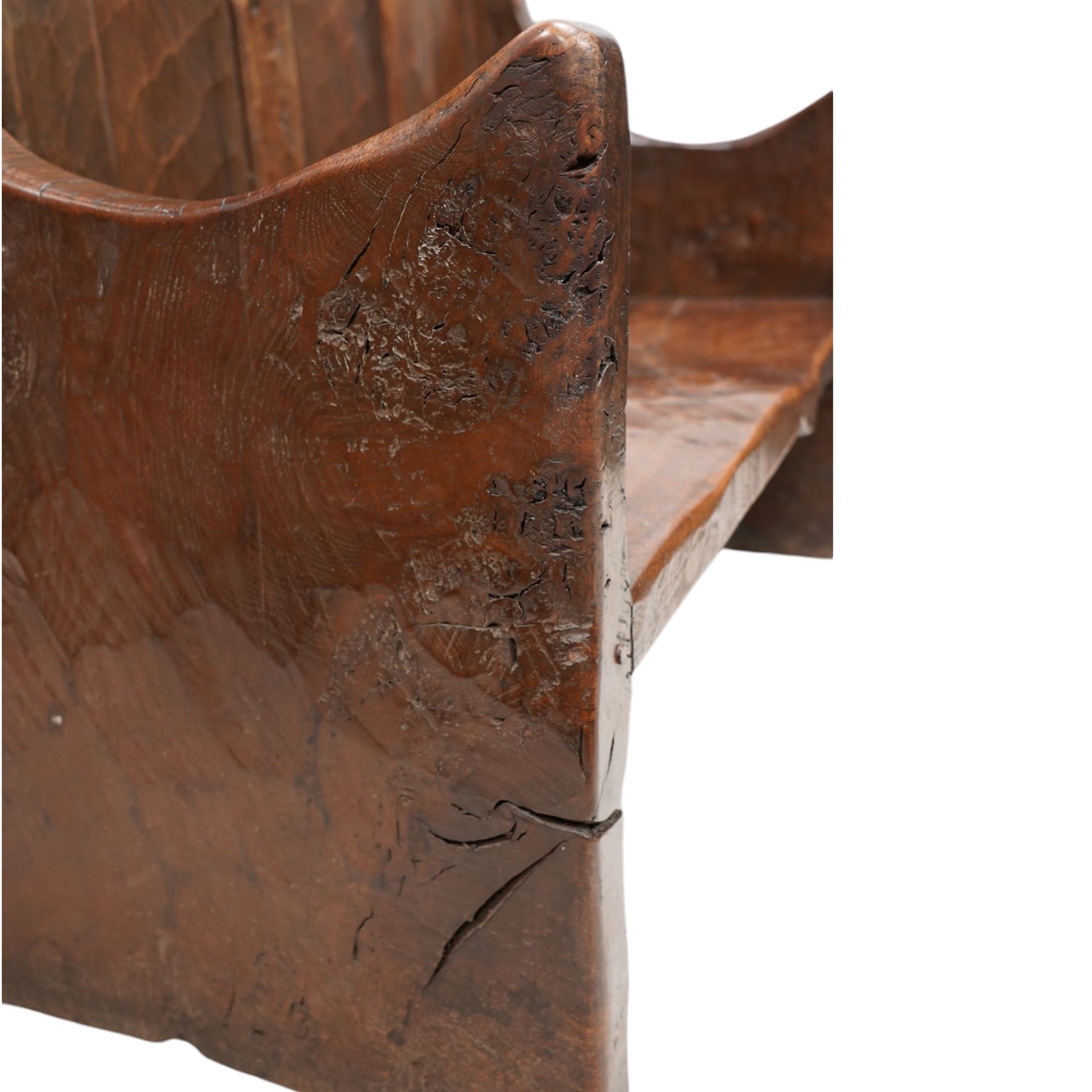 Mouseman - circa. 1920s adzed oak settle or bench, the cresting rail carved with inscription 'Before Honour is Humility', four panel back and plank seat on shaped end supports carved with grotesque masks terminals, carved with mouse signature, by Robert Thompson of Kilburn 
