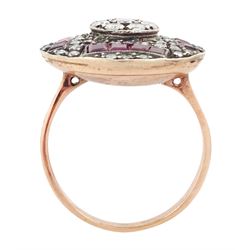 Rose gold and silver ruby and diamond circular ring, the central cluster set with eight round brilliant cut diamonds, with calibre cut ruby and single cut diamond surround, total diamond weight approx 0.90 carat, total ruby weight approx 0.75 carat