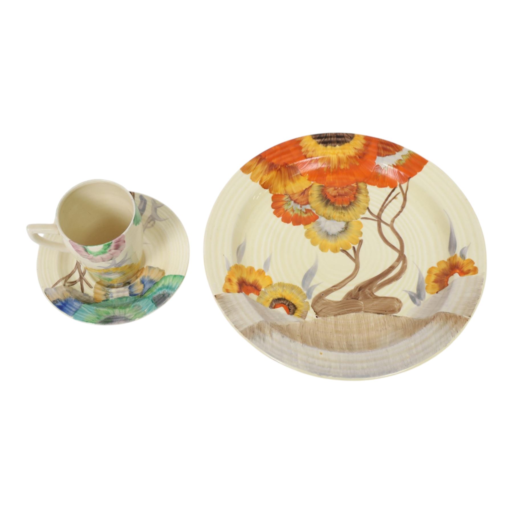 Clarice Cliff Viscaria patter coffee cup and saucer, hand painted with a stylised trees, together with Rhodanthe plate, with Bizarre and printed marks to base, plate D21cm