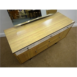  Vintage retro wood laminate chest, four drawers, tapering supports (W80cm, H81cm, D46cm) and matching dressing table, raised mirror back, five drawers and two cupboards (W122cm, H129cm, D46cm) Circular retro coffee table, black top, tapering supports (D71cm, H42cm) and a teak nest of three tables  