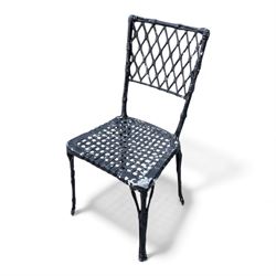 Cast aluminium garden table and chairs in a black finish