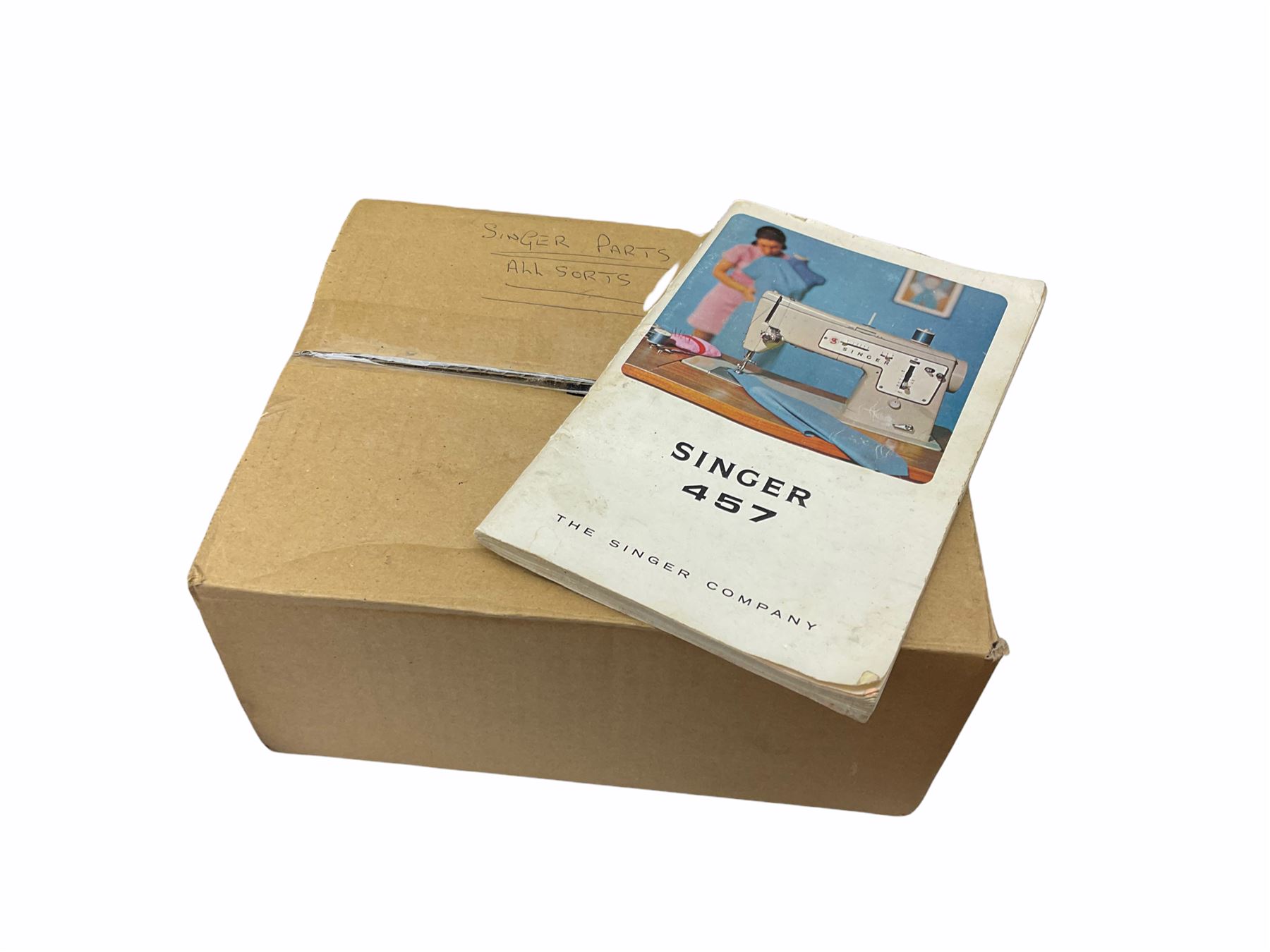 Two Singer sewing machines, model numbers 527 and 457, together with various Singer sewing machine parts, and a selection of sewing related accessories, to include threads, sewing needles, etc. 