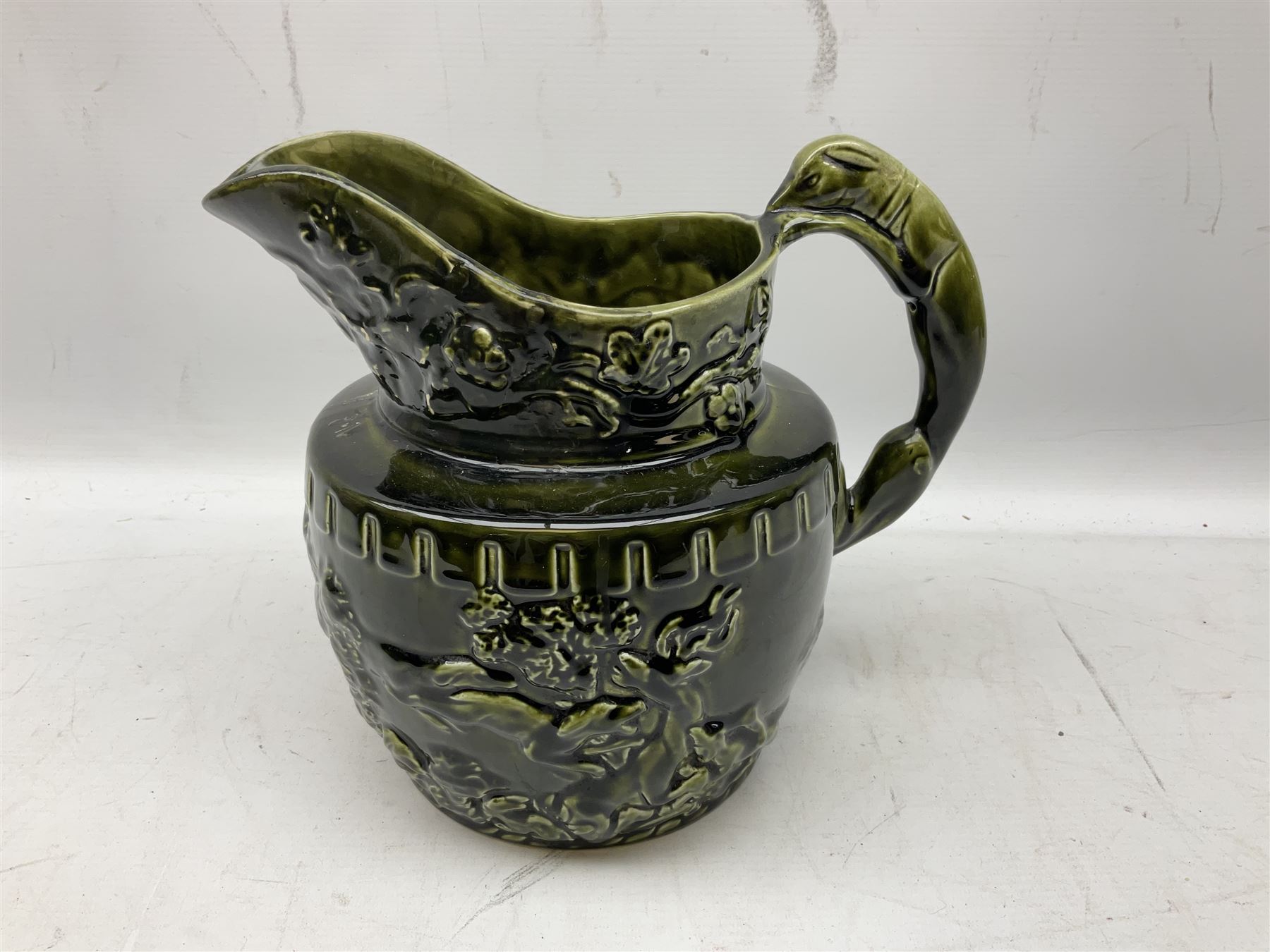 Three jardinières comprising West German Gerz example decorated in relief, Doulton Slaters example with frilled everted rim and a majolica example, and a further two Arthur Wood majolica jugs (5)