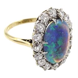 Mid 20th century 18ct gold oval black opal and old cut diamond cluster ring, opal approx 14mm x 9.8mm x depth 4.3mm, total diamond weight approx 0.90 carat, in velvet and silk lined box by Carmichael Ltd, Hull