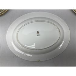 Royal Albert Paragon tea and dinner service for twelve decorated in the Belinda pattern, comprising fourteen saucers, twelve teacups, thirteen side plates, teapot, sauce boat and stand, salt and pepper shakers, two jugs, sucrier, twelve dinner plates, twelve smaller plates, two lidded tureens, twelve bowls, twelve smaller bowls, cake plate, oval plate and oval dish (100)