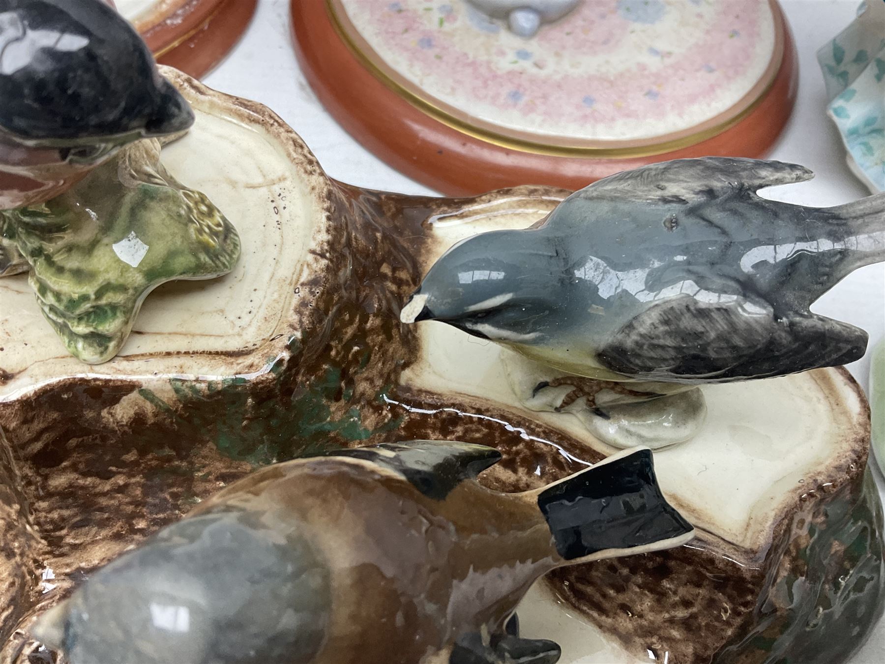 Nine Beswick bird figures, with stand, together with USSR thrush, two Franklin Mint Jane Austin figures and four Royal Doulton figures 