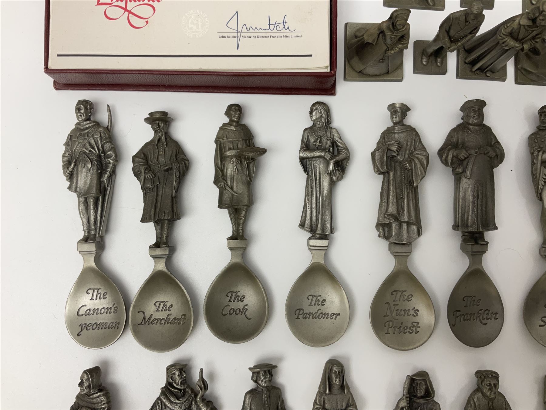 Set of forty three miniature Franklin Mint pewter figures of the Kings and Queens of England, with certificate of authenticity and information cards, together with a collection of twenty four Franklin Mint pewter Charles Dickens character spoons