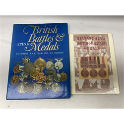Eleven medal reference books including Ian Bisset: The George Cross; Spinks British Battles & Medals; William Spencer: Medals - The Researchers Guide; John D. Clarke: Gallantry Medals & Decorations of the World; Officers of The Green Howards 1931-1972; and six others (11)
