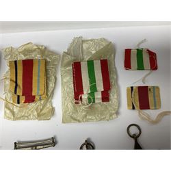 WWII group of three medals comprising 1939-45 War Medal and Italy and Africa Stars in issue box; dog tags for 282894 W. Wilkinson with framed photograph in uniform; and small quantity of cloth and metal badges including RAOC cap badge