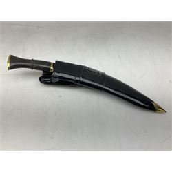 Ceremonial kukri, the 28.5cm curving blade inscribed 'O RDEP NEPAL 9/81' with brass mounted horn grip; in gloss black scabbard with two skinning knives 41cm overall