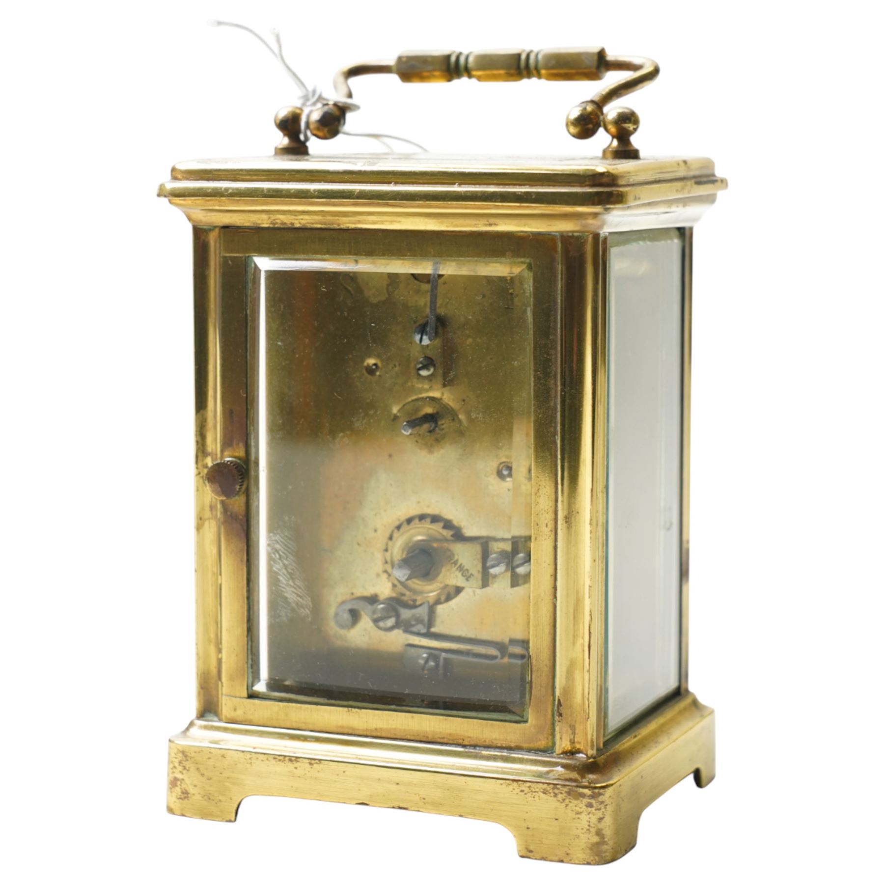 Two early 20th century 8-day French Carriage clocks- one with its original traveling case, lever platform escapement, enamel dial and Roman numerals, the other with a cylinder platform escapement, enamel dial with Roman numerals and five minute Arabic's.  