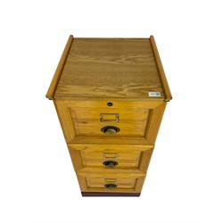 Pine filing cabinet fitted with three graduating drawers