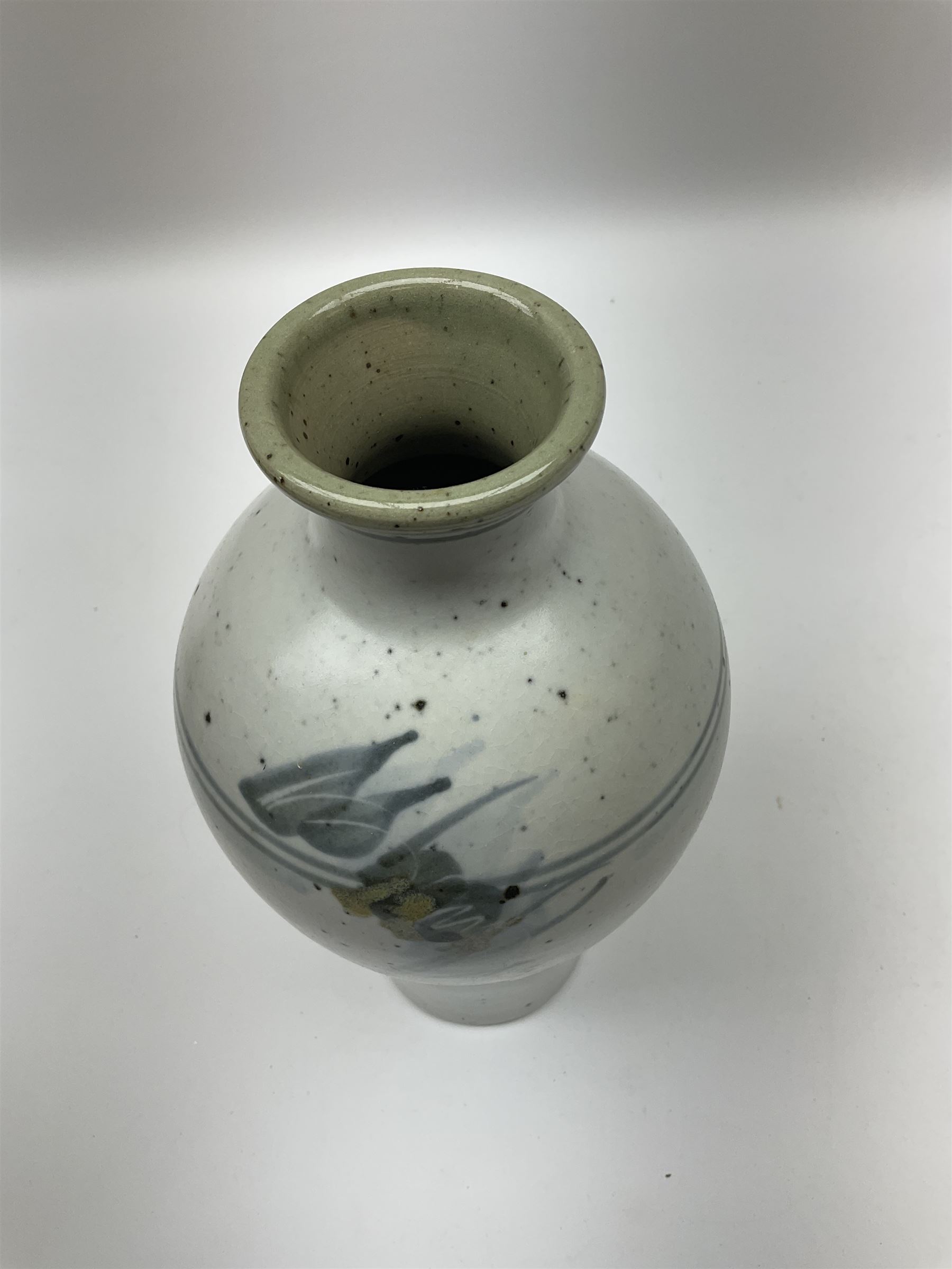 Studio pottery vase of baluster form with a light mottled blue ground with abstract painted decoration, H26cm