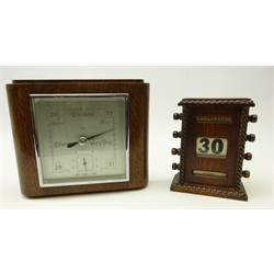  Early 20th century oak perpetual desk calendar, H16.5cm and an Art Deco oak framed barometer (2)  