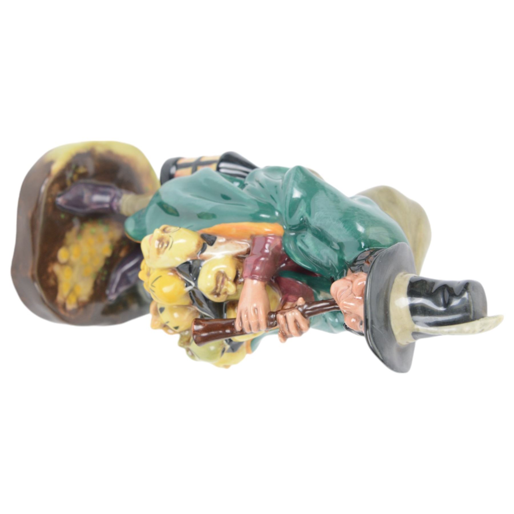 Four Royal Doulton figures, comprising The Mark Seller HN2103, The Wizard HN2877, The Blacksmith Arms HN2782, Morning Ma'am HN2895 