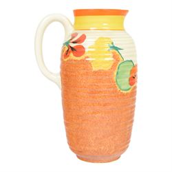 Clarice Cliff Nasturtium jug, shape Greek 563, hand painted with a band of stylised flowers and foliage over a stippled brown ground with orange and yellow banding to the spout,  Bizarre mark beneath, H23cm