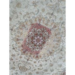 Persian Mahal densely knotted ivory ground carpet, floral rosette medallion surrounded by interlacing leafy branches and palmettes, scrolling border decorated with foliate motifs, within guard stripes, with signature panels to each end