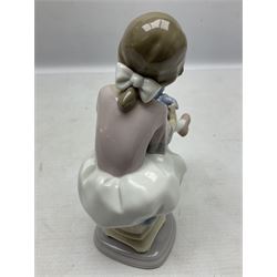 Two Lladro figures, comprising Christening no 5618 and Best Friend no 7620, both with original boxes, largest example H16cm