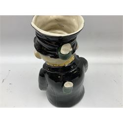 19th century and later Toby jugs comprising Staffordshire Punch and Judy jugs, Victorian 'I am on the black list' jug, two jugs in the form of Toby with a jug of beer (5)