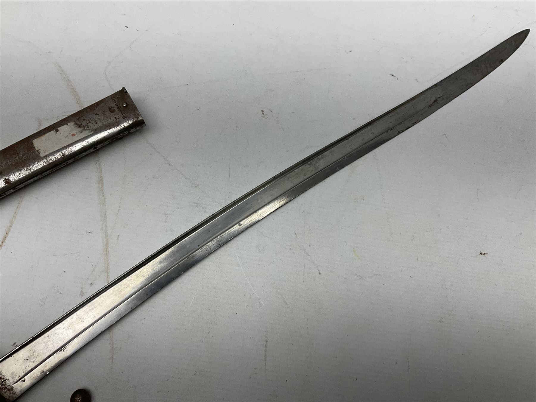 French model 1866 sabre bayonet, the 57.5cm curving blade marked St. Etienne 1873; in associated steel scabbard L71cm; and Mosin-Nagant M1891 socket bayonet with 43cm cruciform blade No.37068 (no scabbard) (2)