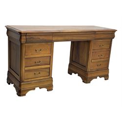 French cherry wood kneehole desk or dressing table, moulded rectangular top over twin pedestal bases each housing three drawers with brass-effect swing handles, resting on bracket feet