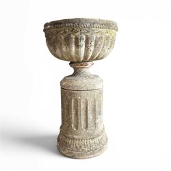 20th century good quality weathered cast stone pedestal urn of ecclesiastical design, circular lobed bowl with rope twist and lattice border, raised on squat base with fluted column  and acanthus decorated base