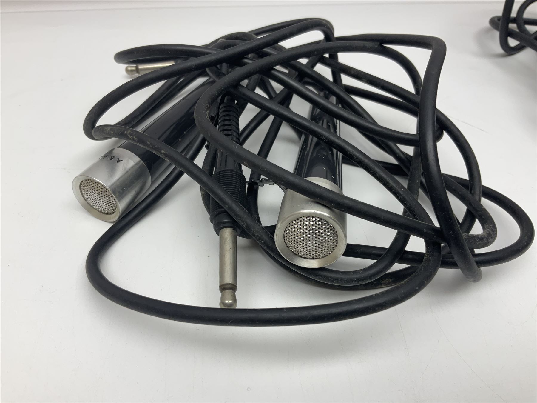 Vintage pair Akai ADM-8 Dynamic microphones; AKG D880 Dynamic microphone; cased; and Shure Betagreen BG1.0 vocal microphone; boxed; all with cables (4)