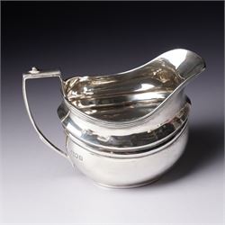 Silver three piece tea set of oval form, the teapot with ebonised handle and lift London 1913 Maker John Hunt and a pair of Victorian silver sugar tongs