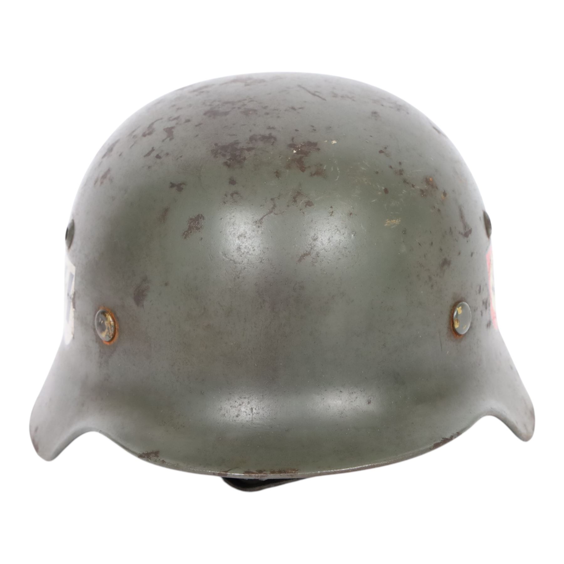 German Third Reich Waffen-SS M35 double decal helmet, the left inner brim stamped SF64, the back inner brim stamped 3866, with leather eight tongue liner and chinstrap