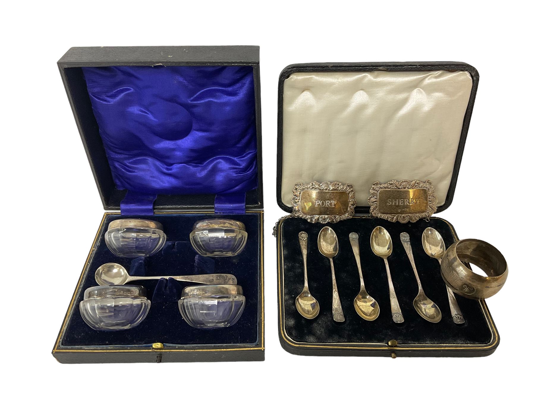 Cased set of six spoons by Cooper Brothers & Sons, two hallmarked silver decanter labels, four silver collared glass salts in box, further silver spoon and napkin ring
