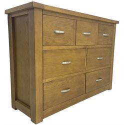 Light oak chest, fitted with seven drawers