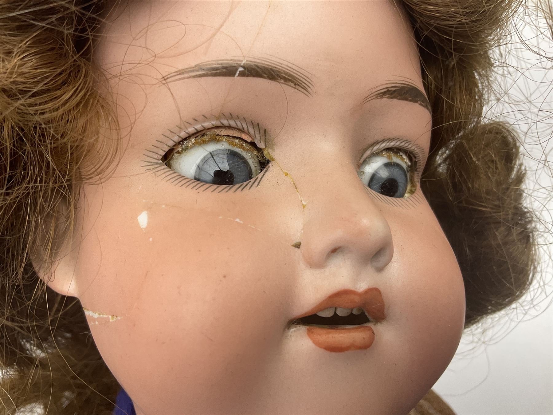 Catterfelder Puppenfabrik Germany bisque head baby doll with moulded hair, sleeping eyes, open mouth with teeth and trembly tongue, and composition body with jointed limbs; marked 'C.P. 208/50 V S' H50cm; together with an Armand Marseille bisque head doll with applied hair, sleeping eyes, open mouth with teeth and composition body with jointed limbs; marked 'Made in Germany Armand Marseille 390n D.R.G.M. 246/1 A. 6 M.' H56cm (2)